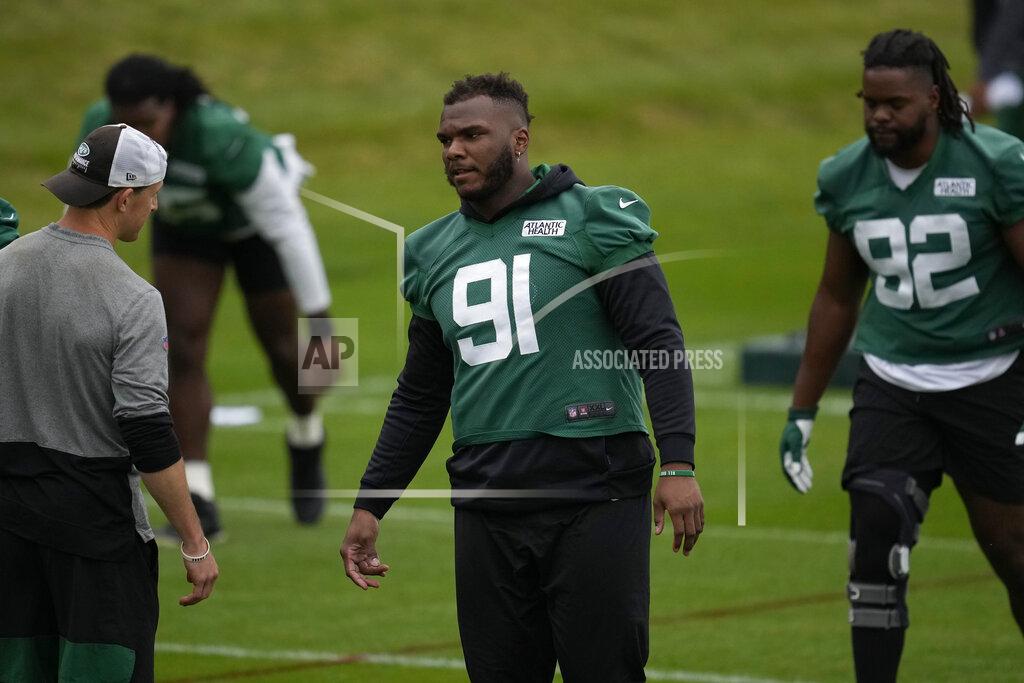 Matt Dunham New York Jets' Defensive lineman John Franklin-Myers, 91, takes part in an NFL practice session at Hanbury Manor Marriott Hotel and Country Club near the town of Ware in south east England, Friday, Oct. 8, 2021. The New York Jets are preparing for an NFL regular season game against the Atlanta Falcons in London on Sunday. (AP Photo/Matt Dunham)