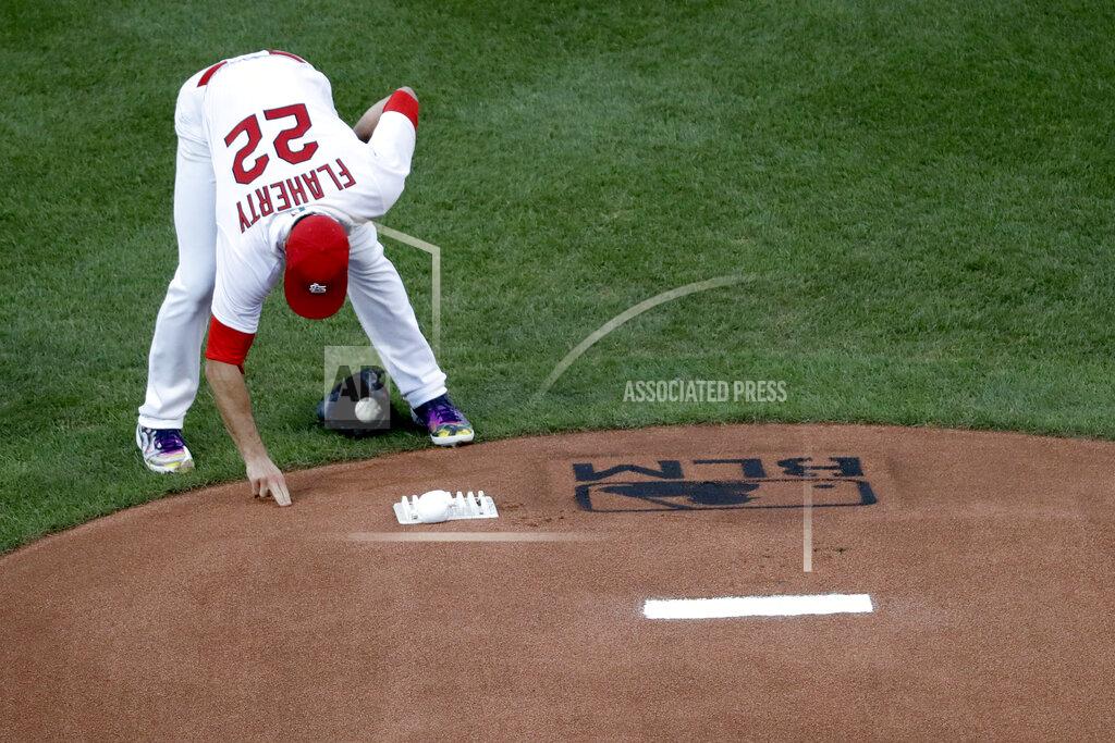 Jeff Roberson St. Louis Cardinals pitcher Jack Flaherty touches the mound near a Black Lives Matter logo before starting a baseball game against the Pittsburgh Pirates Friday, July 24, 2020, in St. Louis. (AP Photo/Jeff Roberson)