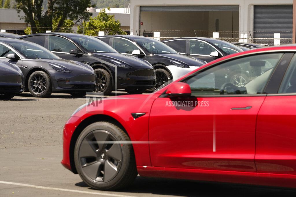 Eric Risberg New electric cars are parked at a Tesla delivery location and service center Friday, April 2, 2021, in Corte Madera, Calif. The president and auto industry maintain the nation is on the cusp of a gigantic shift to electric vehicles and away from liquid-fueled cars, but biofuels producers and some of their supporters in Congress aren't buying it and argue now is the time to increase sales of ethanol and biodiesel, not abandon them. (AP Photo/Eric Risberg)