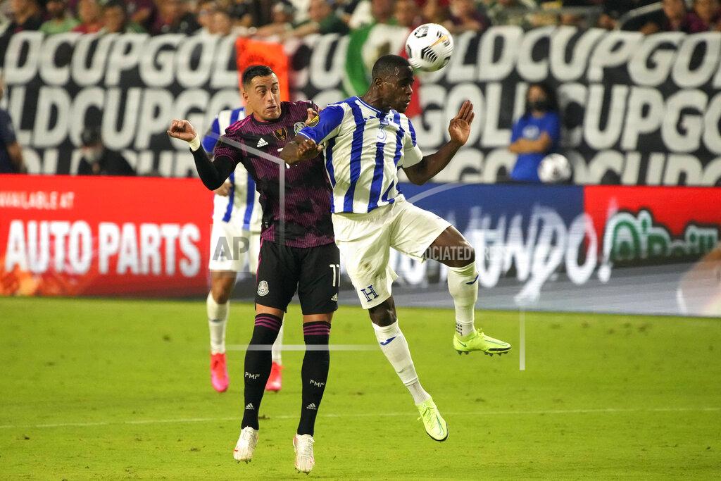 Rick Scuteri Honduras defenseman Maynor Figueroa (30 and Mexico forward Rogelio Funes Mori vie for the ball during the second half of a CONCACAF Gold Cup soccer match Saturday, July 24, 2021, in Glendale, Ariz. (AP Photo/Rick Scuteri)