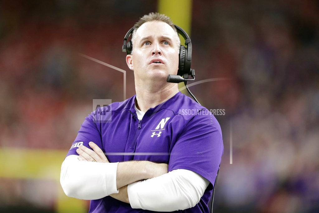 Michael Conroy Northwestern head coach Pat Fitzgerald watches a replay of running back John Moten IV touchdown run during the first half of the Big Ten championship NCAA college football game against Ohio State, Saturday, Dec. 1, 2018, in Indianapolis. (AP Photo/Michael Conroy)