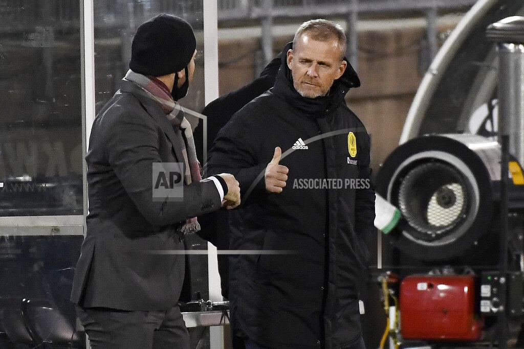 Jessica Hill Nashville SC head coach Gary Smith gestures a thumbs up to Toronto FC head coach Greg Vanney before the start of an MLS soccer playoff match, Tuesday, Nov. 24, 2020, in East Hartford, Conn. (AP Photo/Jessica Hill)