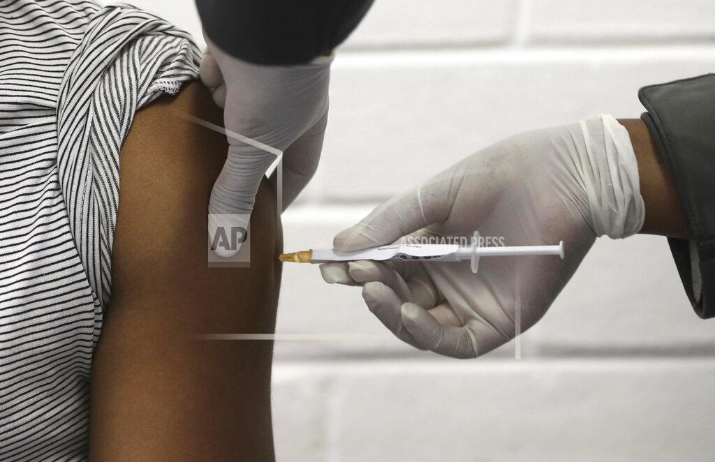 Siphiwe Sibeko FILE - In this Wednesday, June 24, 2020 file photo, a volunteer receives an injection at the Chris Hani Baragwanath hospital in Soweto, Johannesburg. Refrigeration, cargo planes, and, above all, money: All risk being in short supply for the international initiative to get coronavirus vaccines to the world’s most vulnerable people. (Siphiwe Sibeko/Pool via AP, File)