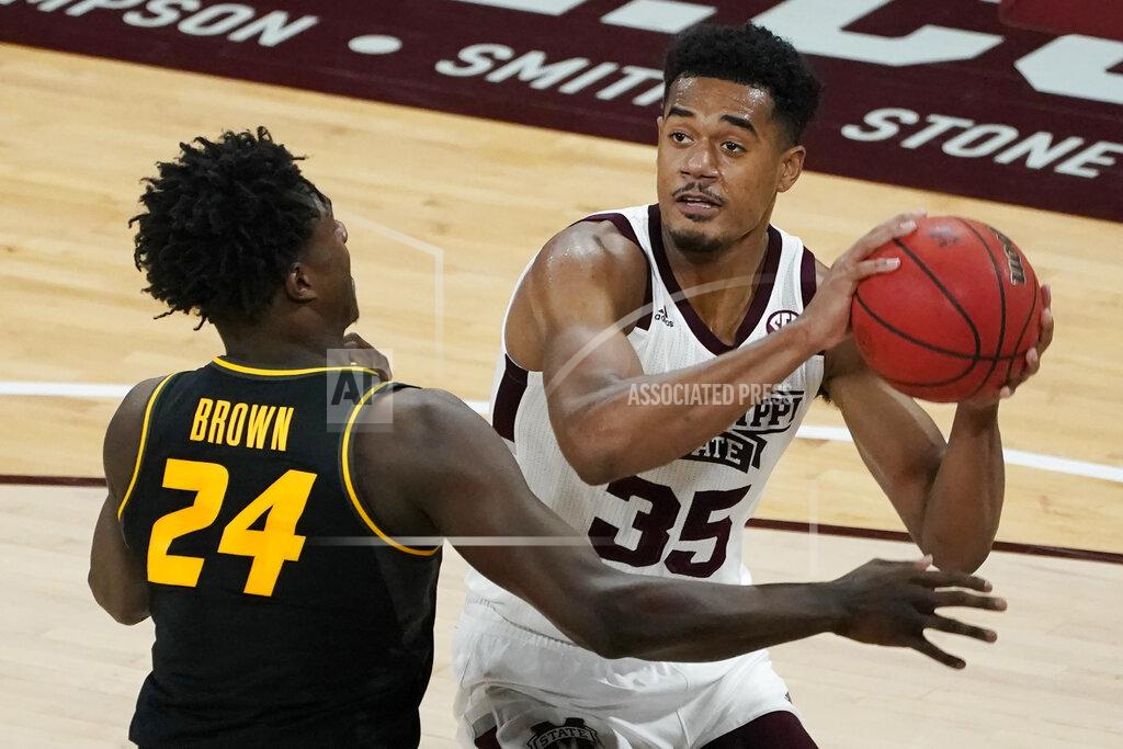 Rogelio V. Solis Mississippi State forward Tolu Smith (35) tries to pass the ball while defended by Missouri forward Kobe Brown (24) during the first half of an NCAA college basketball game Tuesday, Jan. 5, 2021, in Starkville, Miss. (AP Photo/Rogelio V. Solis)