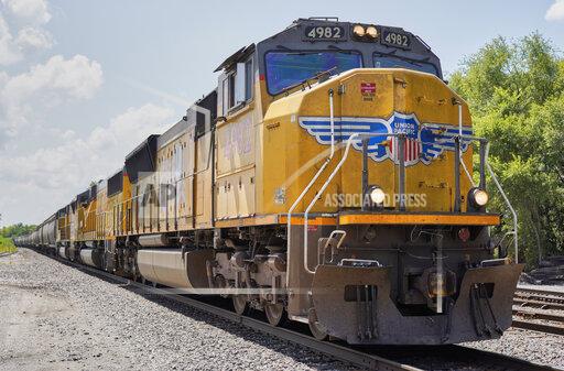 FILE - In this July 31, 2018, file photo, a Union Pacific train travels through Union, Neb. Union Pacific and its labor unions are suing each other to determine whether the railroad has the authority to require its employees to get vaccinated against the coronavirus. (AP Photo/Nati Harnik, File)