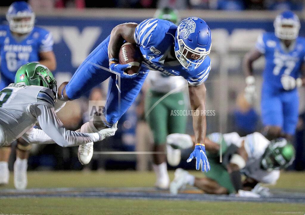 Jim Weber Memphis receiver Antonio Gibson is taken down by Tulane's Willie Langham during an NCAA college football game Saturday, Oct. 19, 2019, in Memphis, Tenn. (Jim Weber/Daily Memphian via AP)