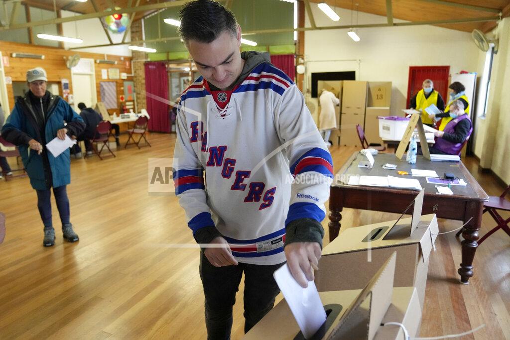 Rick Rycroft A man casts his ballot at an inner Sydney polling station, Australia, Saturday, May 21, 2022. Australians go to the polls following a six-week election campaign that has focused on pandemic-fueled inflation, climate change and fears of a Chinese military outpost being established less than 1,200 miles off Australia's shore. (AP Photo/Rick Rycroft)