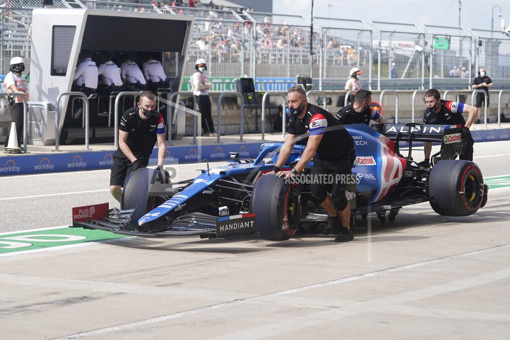 Darron Cummings The crew for Alpine driver Fernando Alonso, of Spain, push his car back to the garage during a practice session for the F1 US Grand Prix auto race at the Circuit of the Americas, Friday, Oct. 22, 2021, in Austin, Texas. (AP Photo/Darron Cummings)