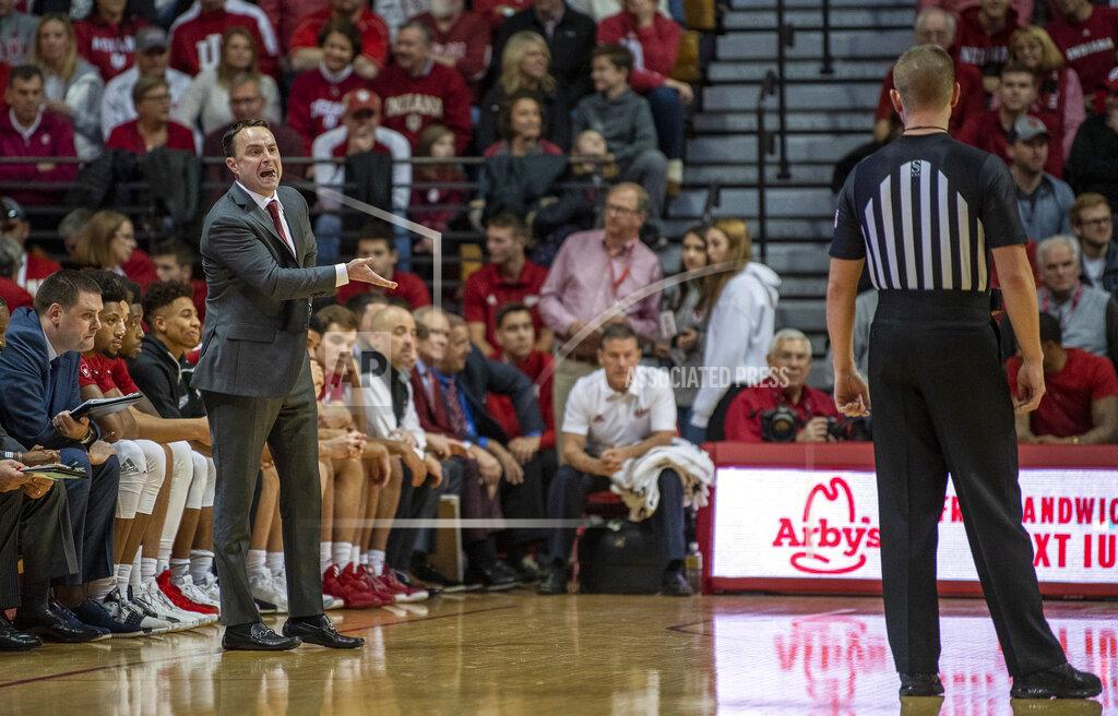 Rich Janzaruk Indiana's head coach Archie Miller, left talks with an official, right, during an NCAA college basketball game against Troy in Bloomington, Ind., Saturday, Nov. 16, 2019. (Rich Janzaruk/The Herald-Times via AP)