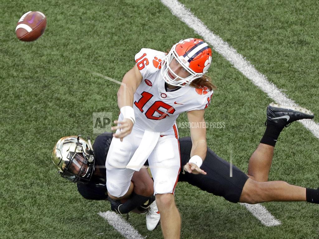 Chuck Burton Clemson's Trevor Lawrence (16) throws a pass against Wake Forest during the second half of an NCAA college football game in Charlotte, N.C., Saturday, Oct. 6, 2018. (AP Photo/Chuck Burton)