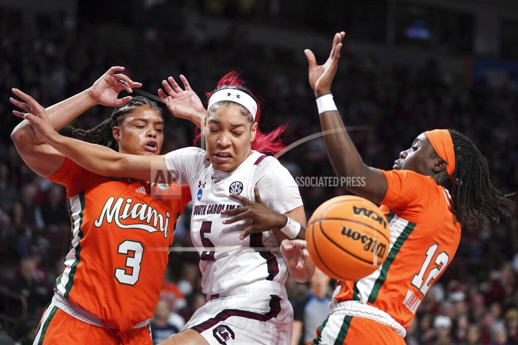 Sean Rayford South Carolina forward Victaria Saxton (5) battles for the ball against Miami forward Destiny Harden (3) and guard Ja'Leah Williams (12) during the first half a second-round game in the NCAA college basketball tournament Sunday, March 20, 2022 in Columbia, S.C. (AP Photo/Sean Rayford)