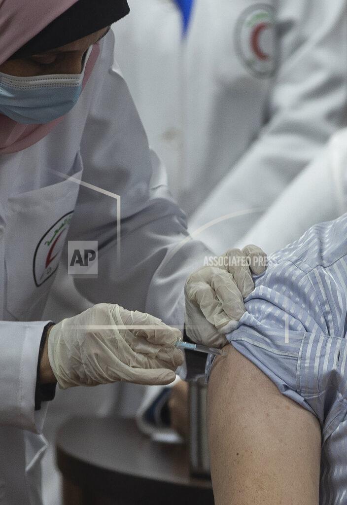 Khalil Hamra A Palestinian medic gives a shot of the Russian-made Sputnik V coronavirus vaccine, in Gaza City, Monday, Feb. 22, 2021. (AP Photo/Khalil Hamra)