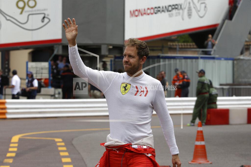 Luca Bruno Ferrari driver Sebastian Vettel of Germany waves to the crowd during the second practice session at the Monaco racetrack, in Monaco, Thursday, May 23, 2019. The Formula one race will be held on Sunday. (AP Photo/Luca Bruno)