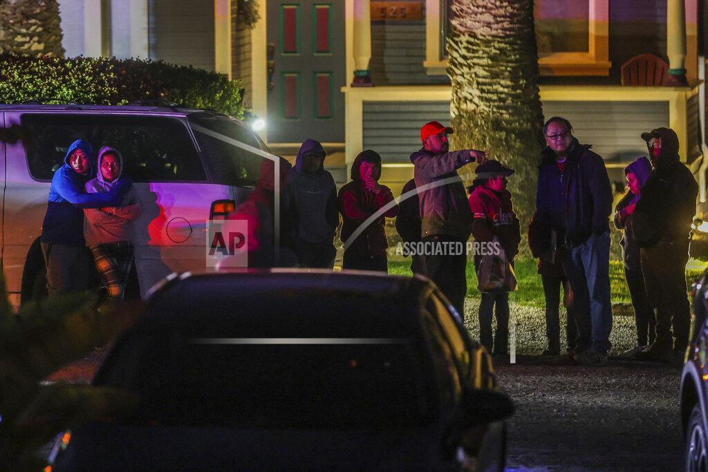 Gabrielle Lurie People embrace at the scene of a deadly shooting where several fatalities occurred off state Highway 92 in Half Moon Bay, Calif., on Monday, Jan. 23, 2023. (Gabrielle Lurie/San Francisco Chronicle via AP)