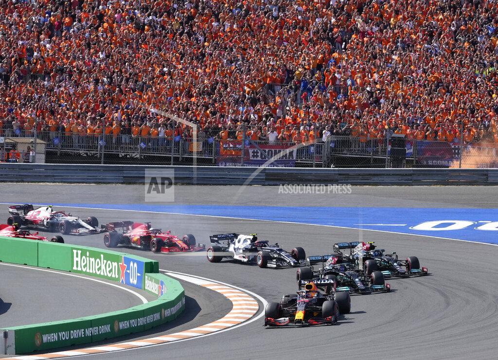 Peter Dejong Red Bull driver Max Verstappen of the Netherlands leads at the start and followed by Mercedes driver Lewis Hamilton of Britain and Mercedes driver Valtteri Bottas of Finland during the Formula One Dutch Grand Prix, at the Zandvoort racetrack, Netherlands, Sunday, Sept. 5, 2021. (AP Photo/Peter Dejong)