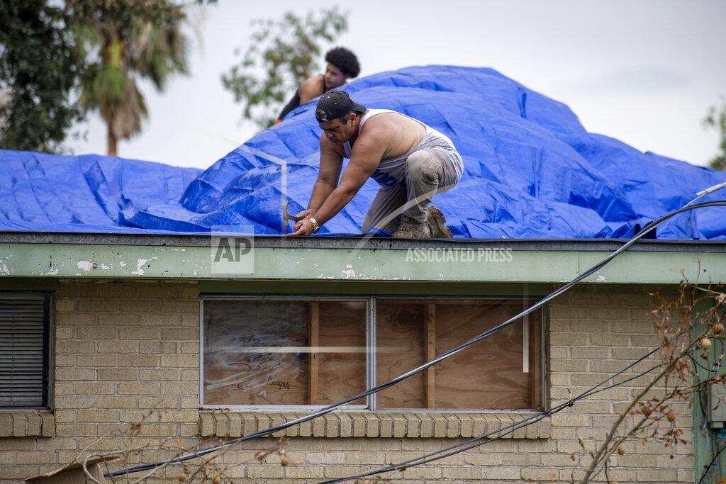 Chris Granger A roof is covered with tarps on Monday, Sept. 6, 2021, in Kenner, La., a week after Hurricane Ida swept through the area. (Chris Granger/The Times-Picayune/The New Orleans Advocate via AP)