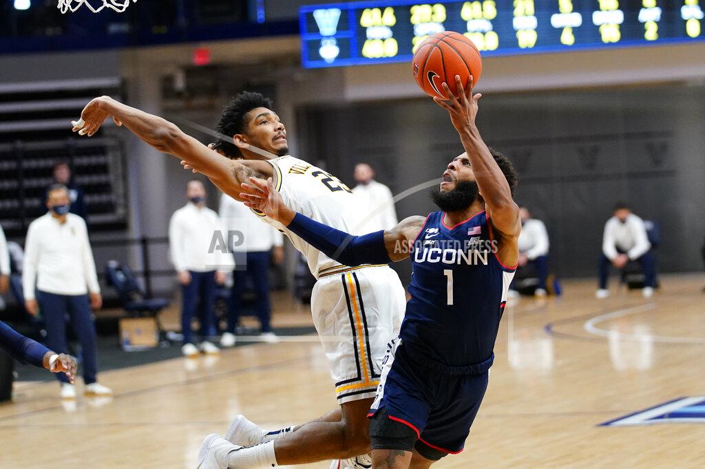 Matt Slocum Connecticut's R.J. Cole (1) goes up for a shot against Villanova's Jermaine Samuels (23) during the second half of an NCAA college basketball game, Saturday, Feb. 20, 2021, in Villanova, Pa. (AP Photo/Matt Slocum)