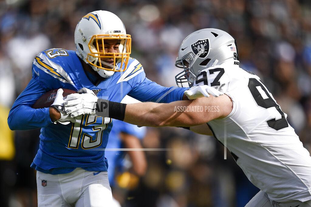 Kelvin Kuo Los Angeles Chargers wide receiver Keenan Allen, left, is tackled by by Oakland Raiders defensive end Josh Mauro during the first half of an NFL football game Sunday, Dec. 22, 2019, in Carson, Calif. (AP Photo/Kelvin Kuo)