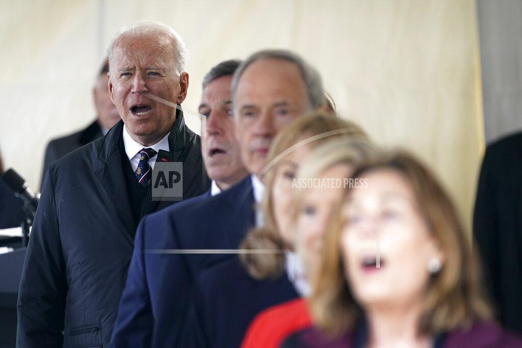 Patrick Semansky President Joe Biden sings "God Bless America" during a Memorial Day event at Veterans Memorial Park at the Delaware Memorial Bridge in New Castle, Del., Sunday, May 30, 2021. (AP Photo/Patrick Semansky)