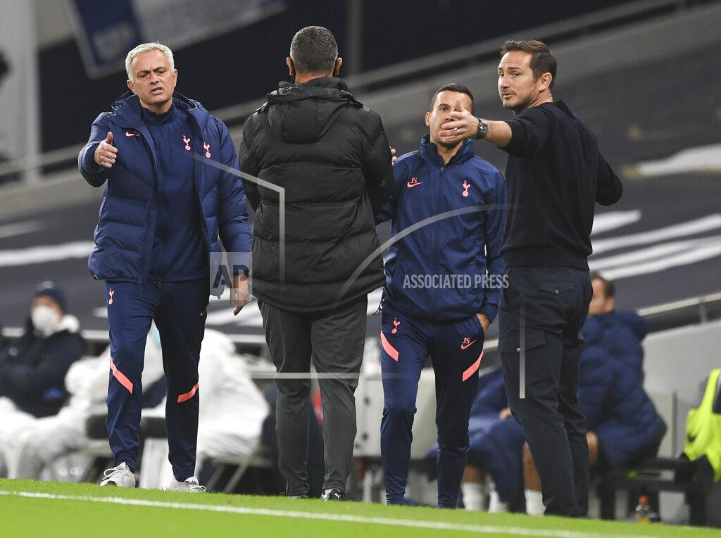 Neil Hall Tottenham's manager Jose Mourinho, left, and Chelsea's head coach Frank Lampard gesture to each other during the English League Cup fourth round soccer match between Tottenham Hotspur and Chelsea at Tottenham Hotspur Stadium in London, England, Tuesday, Sept. 29, 2020.(Neil Hall/Pool via AP)