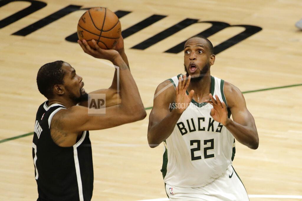 Aaron Gash Brooklyn Nets' Kevin Durant, left, shoots against Milwaukee Bucks' Khris Middleton, right, during the second half of an NBA basketball game Tuesday, May 4, 2021, in Milwaukee. (AP Photo/Aaron Gash)