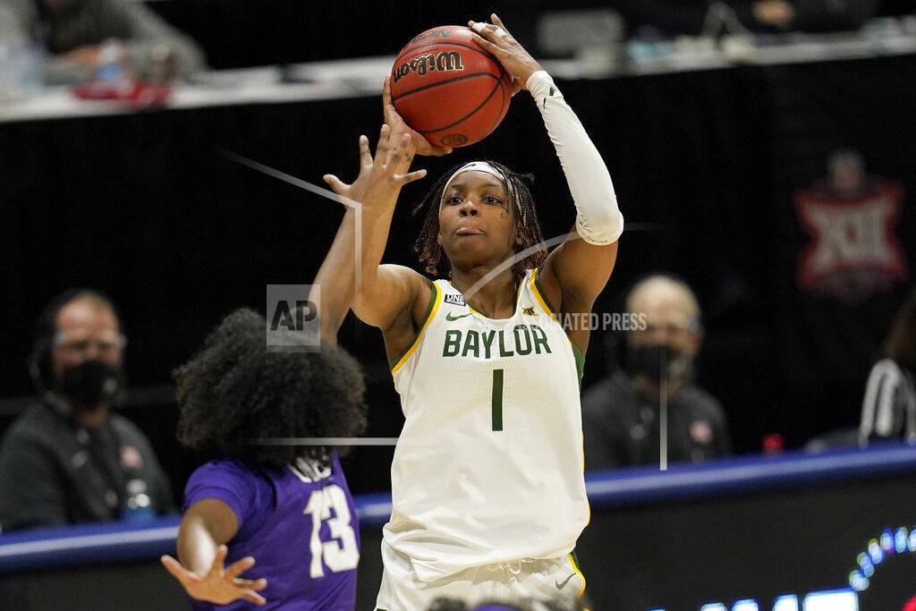 Orlin Wagner FILE - Baylor forward NaLyssa Smith (1) shoots over TCU guard Tavy Diggs (13) during the first half of an NCAA college basketball game in the quarterfinal round of the Big 12 Conference tournament in Kansas City, Mo., in this Friday, March 12, 2021, file photo. Smith was named to the preseason Associated Press NCAA college basketball All-America team on Tuesday, Oct. 26, 2021. (AP Photo/Orlin Wagner, File)