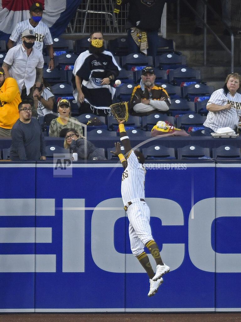 Denis Poroy San Diego Padres left fielder Jorge Mateo makes a catch near the wall on a ball hit by Arizona Diamondbacks' Christian Walker during the fourth inning of a baseball game Saturday, April 3, 2021, in San Diego. (AP Photo/Denis Poroy)