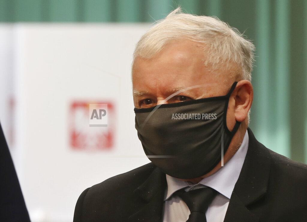Czarek Sokolowski Poland's main ruling party leader Jaroslaw Kaczynski prepares to cast his vote during presidential election in Warsaw, Poland, Sunday, June 28, 2020. The election will test the popularity of incumbent President Andrzej Duda who is seeking a second term in office, and of the conservative ruling party that backs him. (AP Photo/Czarek Sokolowski)