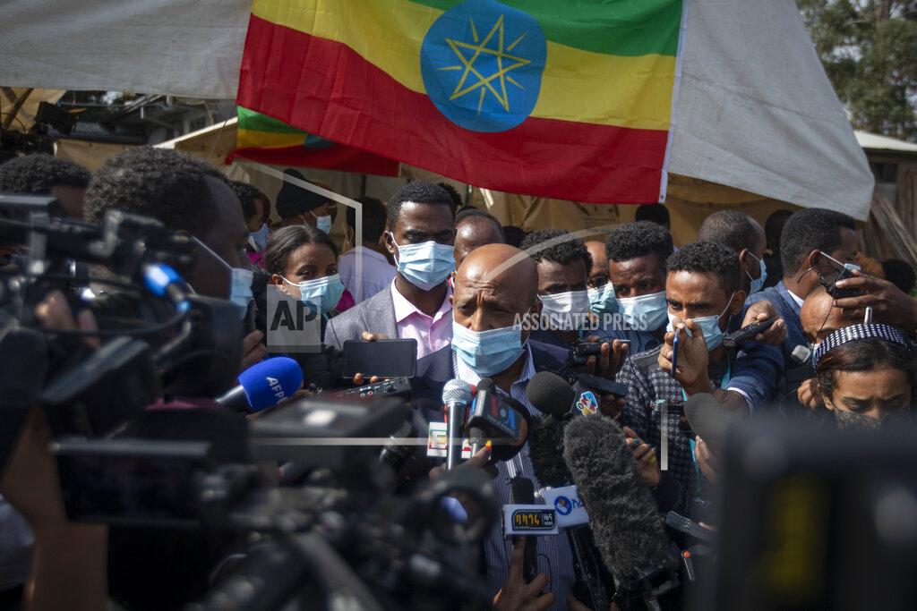 Ben Curtis Berhanu Nega, leader of the Ethiopian Citizens for Social Justice (EZEMA) opposition party, speaks to the media after casting his vote in the general election at a polling center in the capital Addis Ababa, Ethiopia Monday, June 21, 2021. Ethiopia was voting Monday in the greatest electoral test yet for Prime Minister Abiy Ahmed as insecurity and logistical issues meant ballots wouldn't be cast in more than 100 constituencies of the 547 across the country. (AP Photo/Ben Curtis)