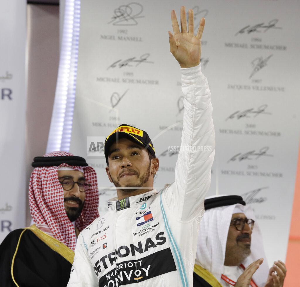 Mercedes driver Lewis Hamilton of Britain celebrates his victory at the end of the Baharain Formula One Grand Prix at the Bahrain International Circuit in Sakhir, Bahrain, Sunday, March 31, 2019. (AP Photo/Luca Bruno)