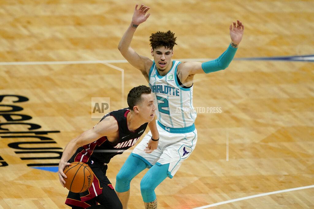 Chris Carlson Miami Heat guard Goran Dragic drives to the basket past Charlotte Hornets guard LaMelo Ball during the first half of an NBA basketball game on Sunday, May 2, 2021, in Charlotte, N.C. (AP Photo/Chris Carlson)