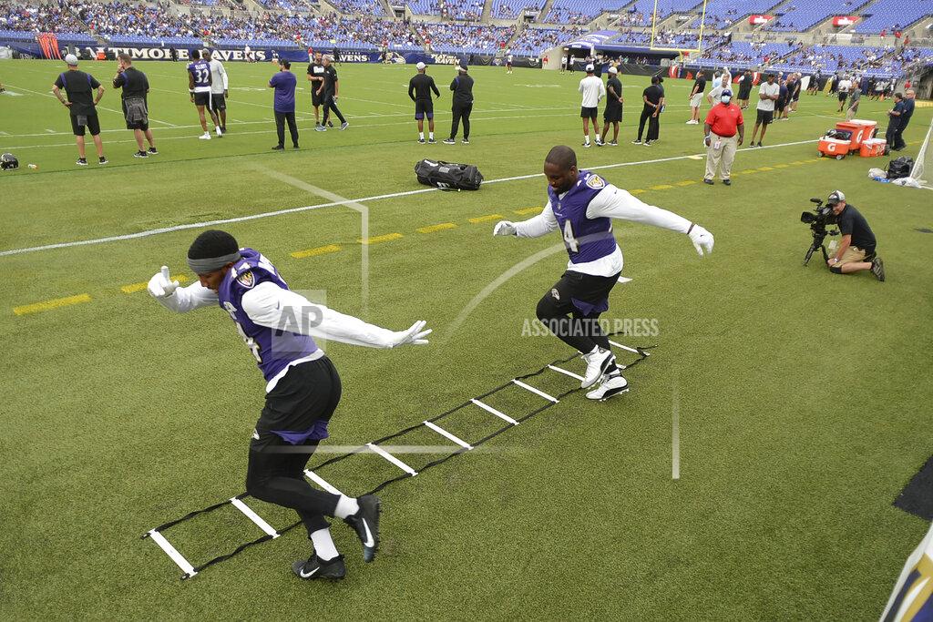 Gail Burton Baltimore Ravens' Marlon Humphrey, left, and Chris Smith practice their footwork during practice at NFL football training camp Saturday, July 31, 2021, in Baltimore. (AP Photo/Gail Burton)