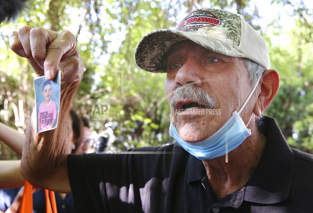 Kin Man Hui George Rodriguez holds up a picture of his grandson, Jose Flores, Jr., one of victims in Tuesday's shootings at Robb Elementary School, Thursday, May 26, 2022, in Uvalde, Texas. (Kin Man Hui/The San Antonio Express-News via AP)