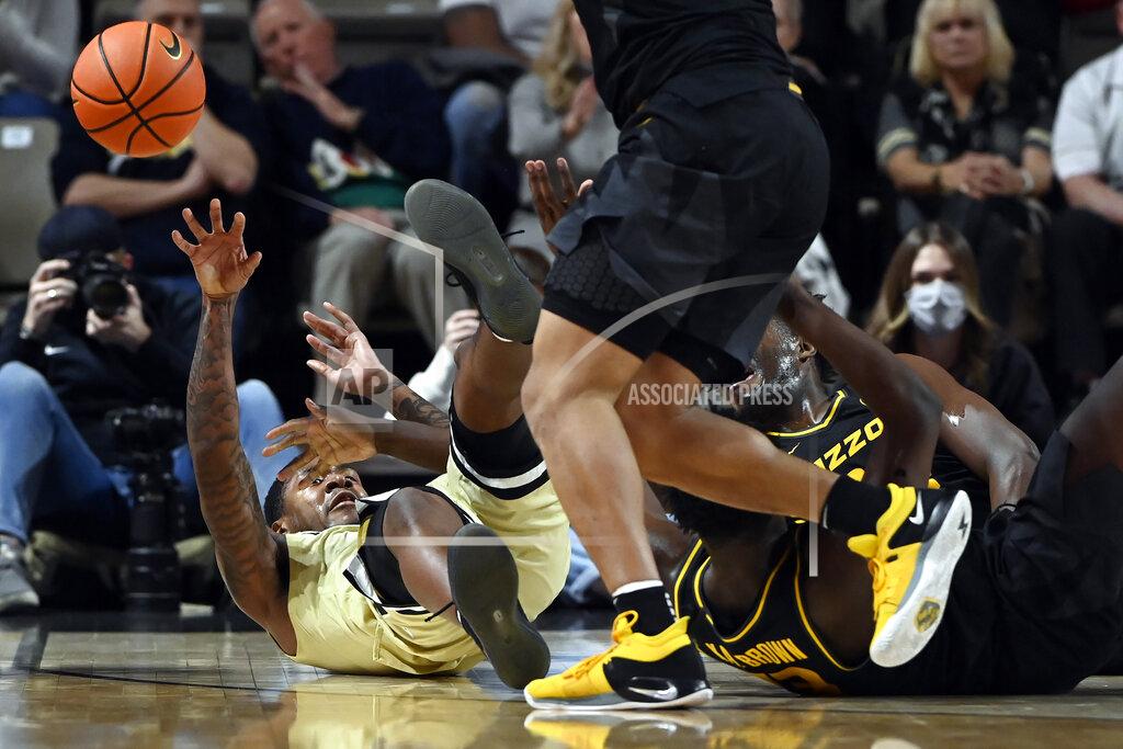Mark Zaleski Vanderbilt guard Shane Dezonie, left, passes the ball after getting control of it during the second half of the team's NCAA college basketball game against Mississippi on Tuesday, Feb. 8, 2022, in Nashville, Tenn. Vanderbilt won 70-62. (AP Photo/Mark Zaleski)