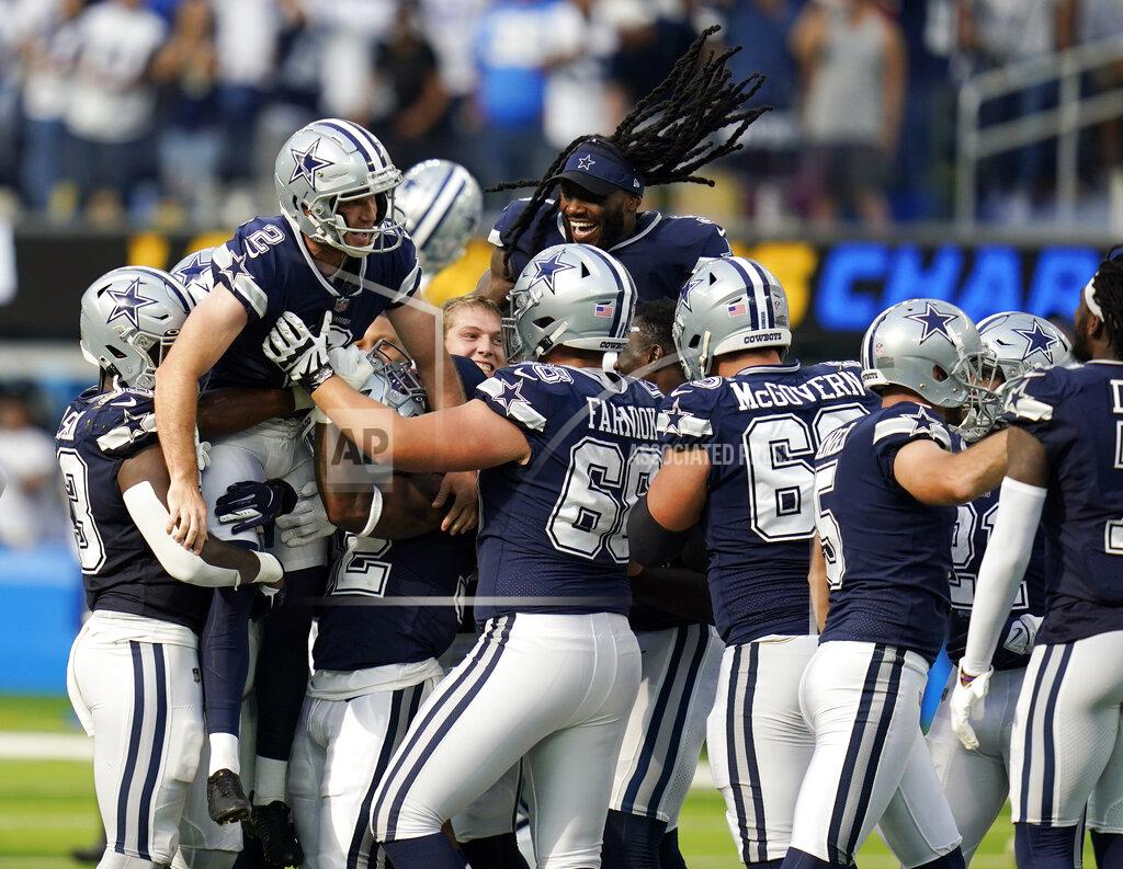 Gregory Bull Dallas Cowboys kicker Greg Zuerlein (2) is lifted by teammates after making the game-winning field goal as time expired during the second half of an NFL football game against the Los Angeles Chargers Sunday, Sept. 19, 2021, in Inglewood, Calif. (AP Photo/Gregory Bull)
