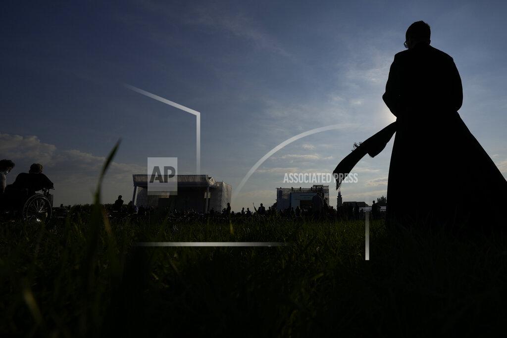 Petr David Josek Faithful wait for Pope Francis' arrival in the esplanade of the National Shrine in Sastin, Slovakia, Wednesday, Sept. 15, 2021. Pope Francis is to hold an open air mass in Sastin near the Slovakian capital on Wednesday, the site of an annual pilgrimage each September 15 to venerate Slovakia's patron, Our Lady of Sorrows. (AP Photo/Petr David Josek)
