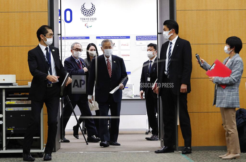 Kim Kyung-Hoon Yoshiro Mori, center, the president of the Tokyo Olympic organizing committee, enters a venue for a news conference in Tokyo Thursday, Feb. 4, 2021. (Kim Kyung-hoon/Pool Photo via AP)