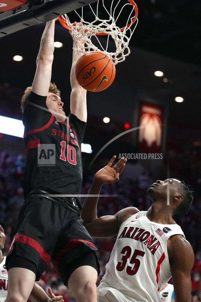 Rick Scuteri Stanford forward Max Murrell (10) dunks over Arizona center Christian Koloko during the first half of an NCAA college basketball game Thursday, March 3, 2022, in Tucson, Ariz. (AP Photo/Rick Scuteri)