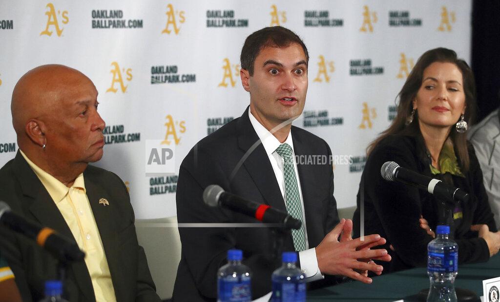 Ben Margot FILE - In this Nov. 28, 2018, file photo Oakland Athletics President Dave Kaval, center, speaks beside Oakland Mayor Libby Schaaf, right, and Ces Butner, president of the Board of Port Commissioners, during a news conference in Oakland, Calif. The Oakland City Council approved Tuesday, July 20, 201, preliminary terms for a new $12 billion waterfront ballpark project for the Athletics. But it's not clear if the 6-1 vote will be enough to keep the A's at the negotiating table instead of leaving the city. Schaaf and city council leaders praised the vote as marking a milestone in negotiations. Kaval said that the financial terms do not work for the team. (AP Photo/Ben Margot, FIle)