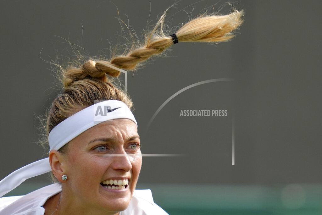 Kirsty Wigglesworth Petra Kvitova of the Czech Republic returns the ball to Italy's Jasmine Paolini during their singles tennis match on day two of the Wimbledon tennis championships in London, Tuesday, June 28, 2022. (AP Photo/Kirsty Wigglesworth)