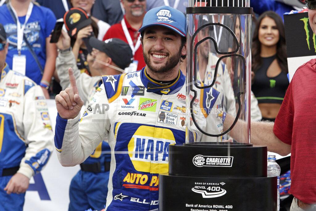 Wesley Broome Chase Elliott poses with the trophy after winning the NASCAR Cup Series auto race at Charlotte Motor Speedway in Concord, N.C., Sunday, Sept. 29, 2019. (AP Photo/Wesley Broome)