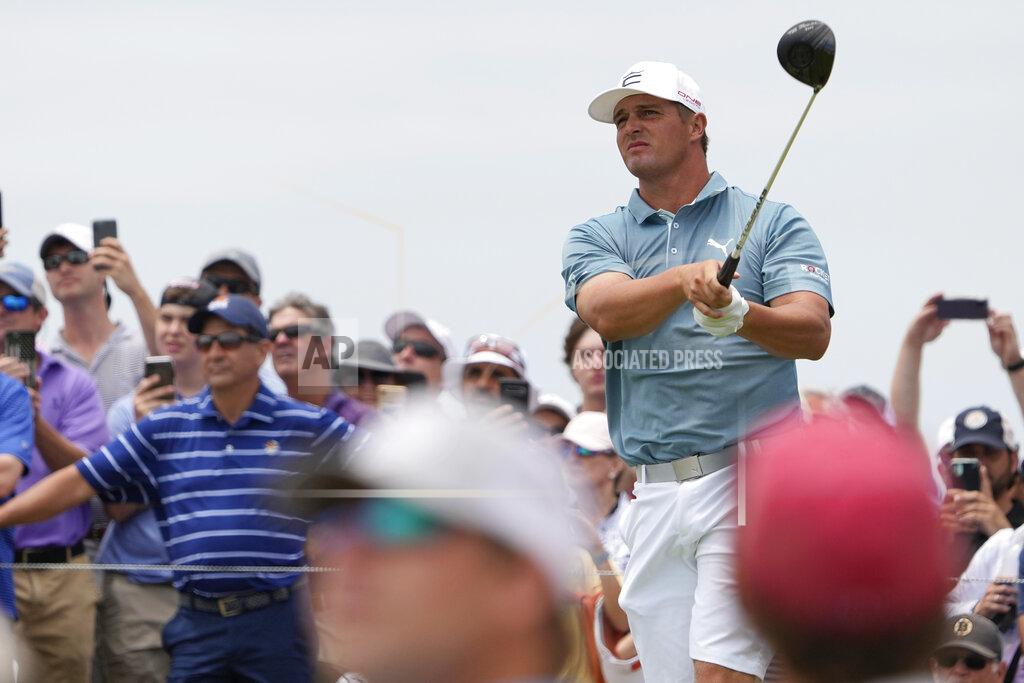 Bryson DeChambeau watches his tee shot on the 14th hole during a practice round at the PGA Championship golf tournament on the Ocean Course Wednesday, May 19, 2021, in Kiawah Island, S.C. (AP Photo/David J. Phillip)