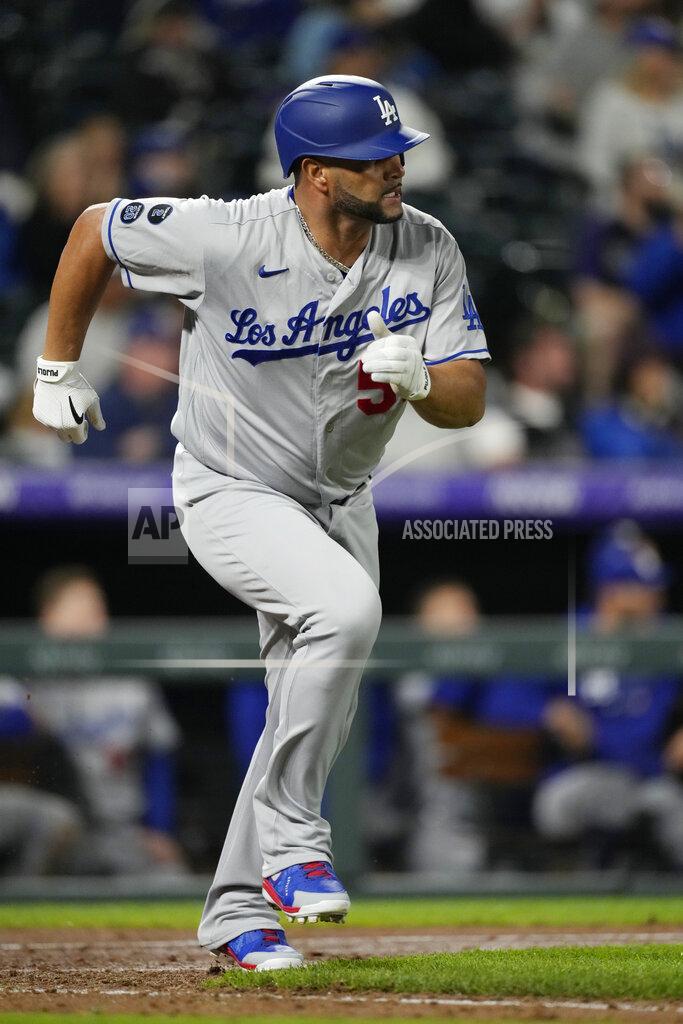 David Zalubowski Los Angeles Dodgers pinch-hitter Albert Pujols heads up the first-base line after hitting an RBI-single off Colorado Rockies relief pitcher Jhoulys Chacin in the 10th inning of a baseball game Tuesday, Sept. 21, 2021, in Denver. The Dodgers won 5-4. (AP Photo/David Zalubowski)