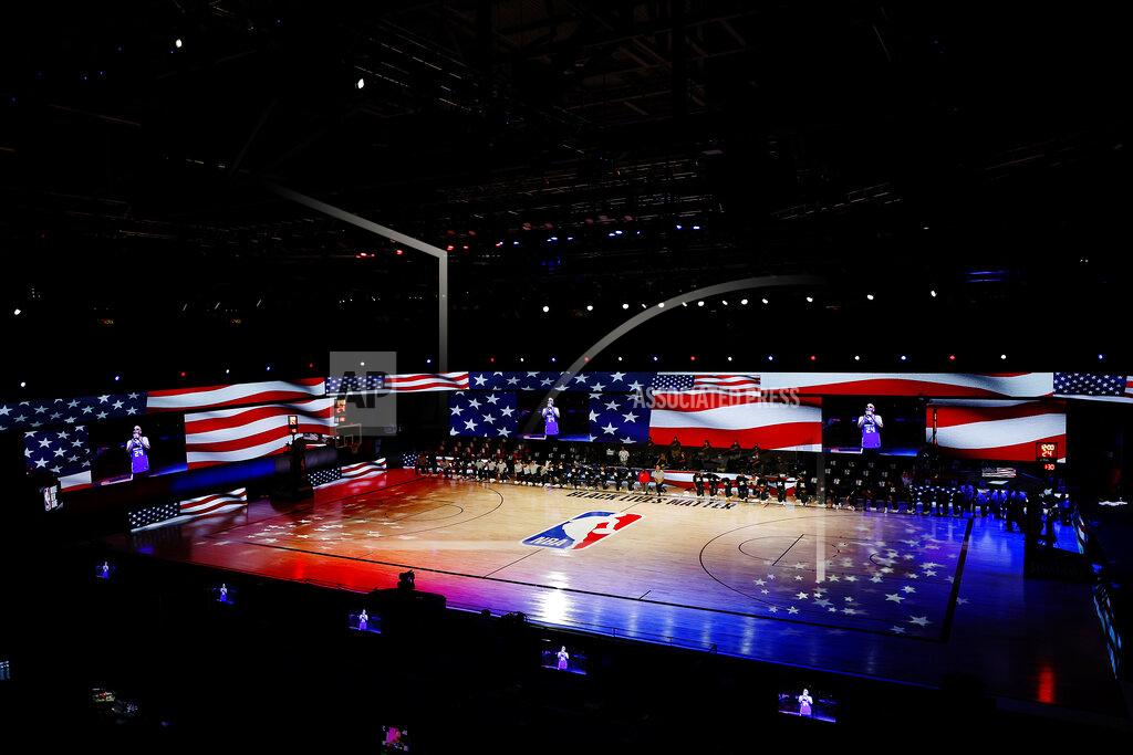 Mike Ehrmann The New Orleans Pelicans and the Sacramento Kings take a knee during the National Anthem prior to the start of the game of an NBA basketball game Tuesday, Aug. 11, 2020, in Lake Buena Vista, Fla. (Mike Ehrmann/Pool Photo via AP)
