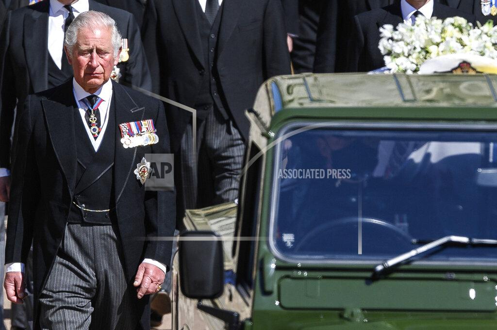 Leon Neal Britain's Prince Charles follows the coffin as it makes it's way past the Round Tower during the funeral of Britain's Prince Philip inside Windsor Castle in Windsor, England Saturday April 17, 2021. (Leon Neal/Pool via AP)