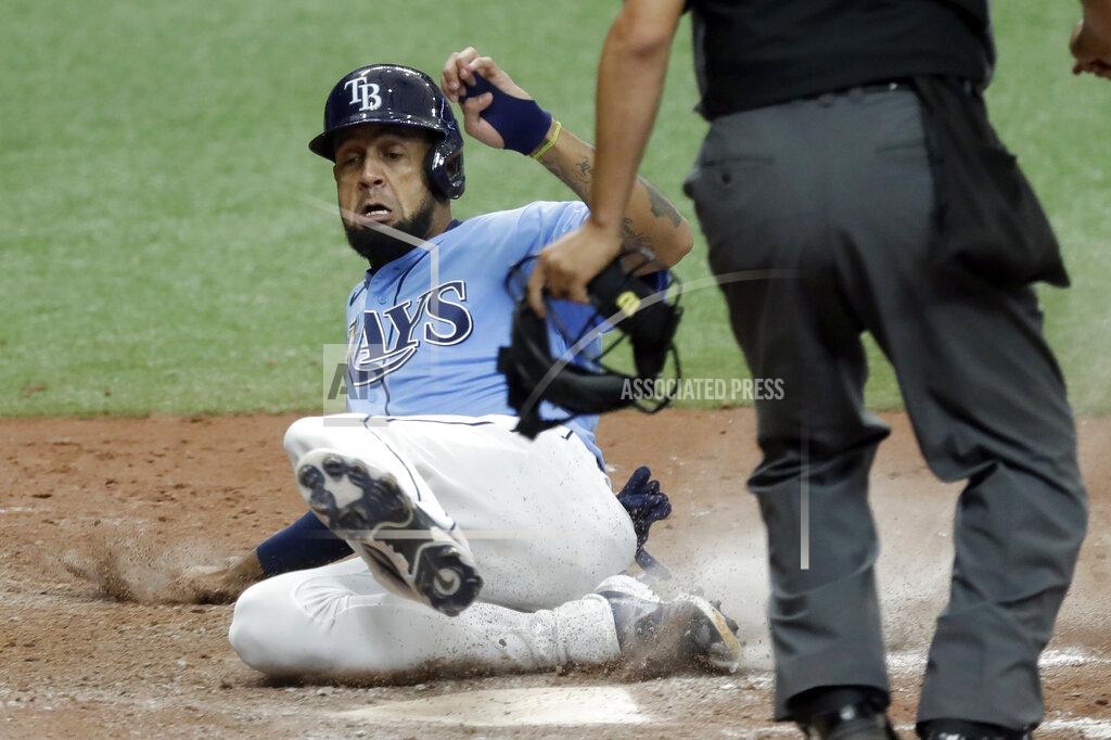 Chris O'meara CORRECTS TO TRIPLE, INSTEAD OF DOUBLE - Tampa Bay Rays' Jose Martinez scores the game-winning run on a two-run, walk-off triple by Kevin Kiermaier off Toronto Blue Jays relief pitcher Shun Yamaguchi during the 10th inning of a baseball game Sunday, July 26, 2020, in St. Petersburg, Fla. (AP Photo/Chris O'Meara)