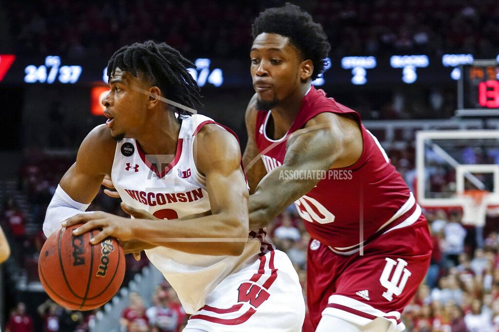 Andy Manis Indiana's De'Ron Davis (20) reaches in on Wisconsin's Aleem Ford (2) during the second half of an NCAA college basketball game Saturday, Dec. 7, 2019, in Madison, Wis. Wisconsin won 84-64. (AP Photo/Andy Manis)