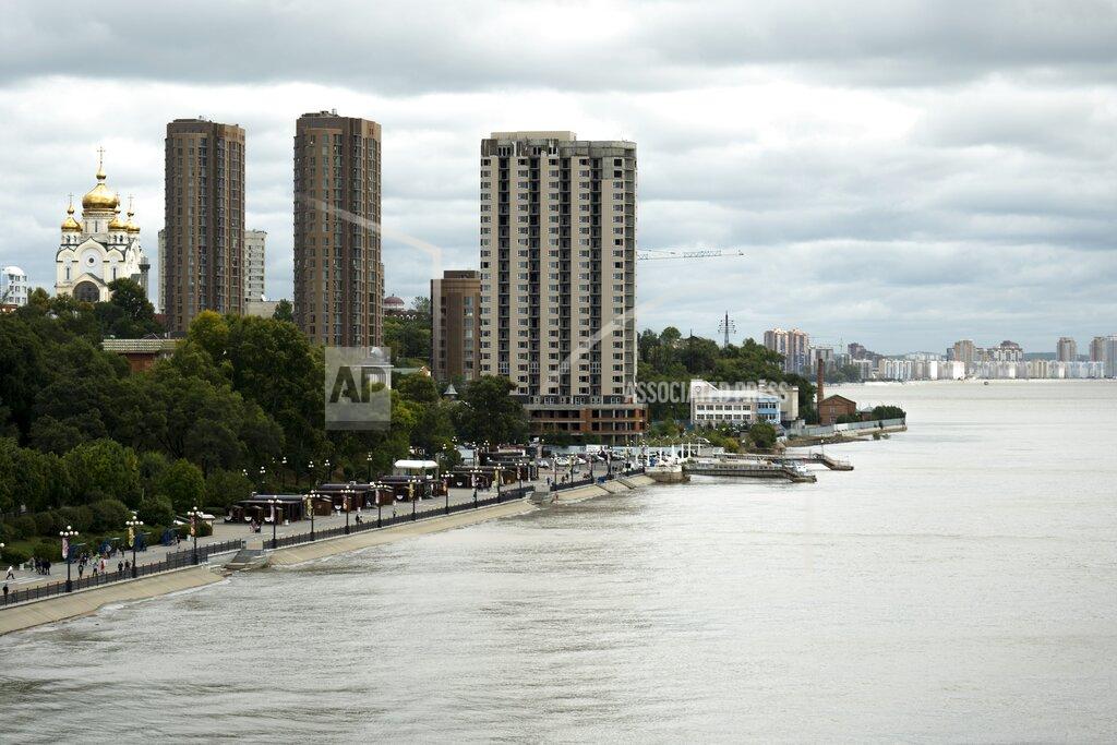 Daniel Kozin Buildings stand near the Amur River in Khabarovsk, Russia, a city in the country's Far East, Sunday, Sept. 12, 2021. The results of parliamentary and local elections that wrap up on Sunday, Sept. 19, 2021, will be closely watched to gauge how much anger against the Kremlin remains in the region, where its popular governor was arrested last year, causing mass protests. (AP Photo/Daniel Kozin)