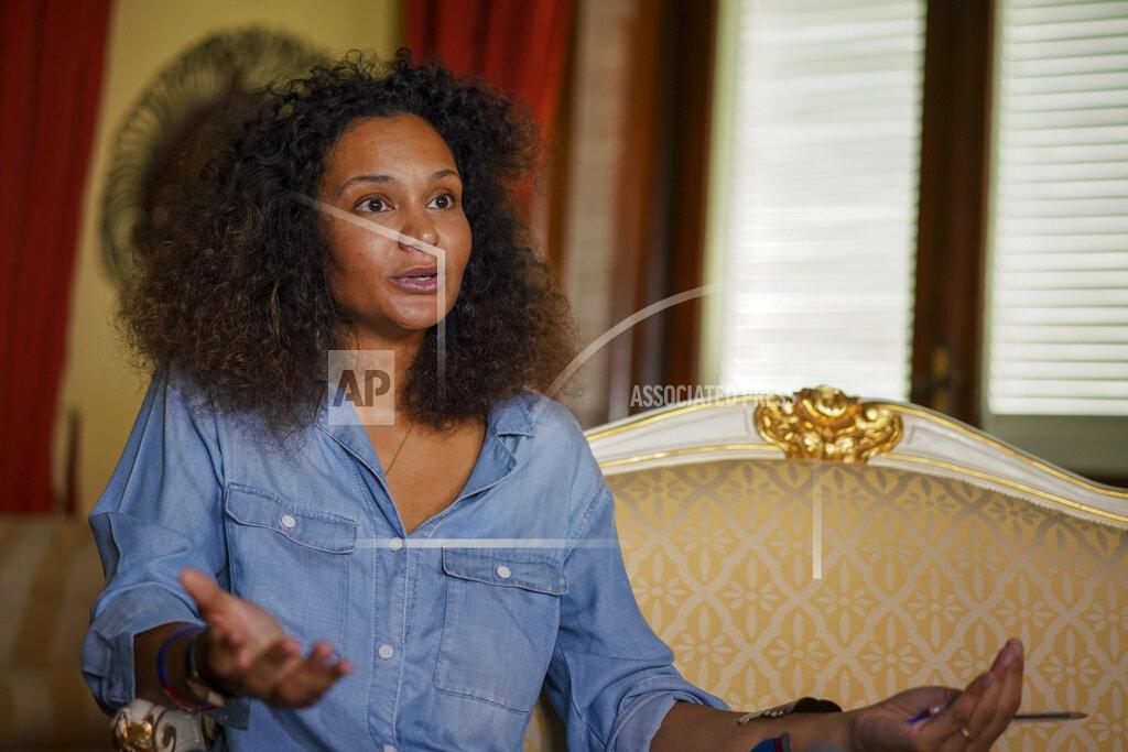 Andrew Medichini FILE - In this Aug. 13, 2020 file photo, fashion designer Stella Jean talks during an interview with the Associated Press, in Rome. A digital runway show by five Italian fashion designers of African origin opens Milan Fashion Week on Wednesday, Feb. 24, 2020, one tangible result of a campaign launched last summer by the only Black Italian designer belonging to the Italian fashion chamber. (AP Photo/Andrew Medichini, file)