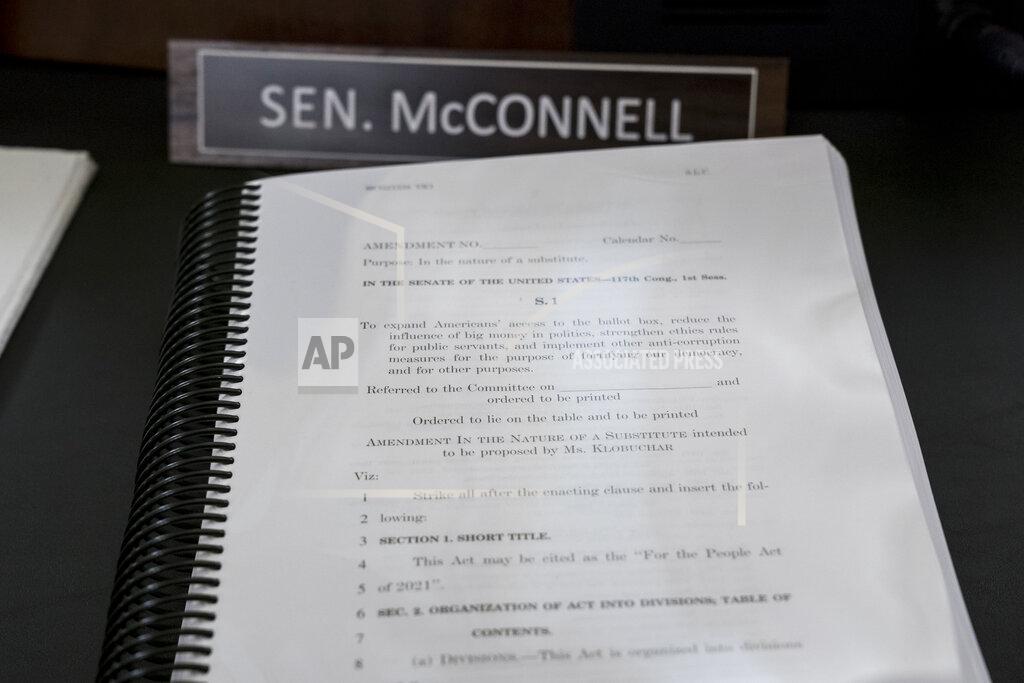 J. Scott Applewhite A book of amendments awaits Senate Minority Leader Mitch McConnell of Ky., at a Senate Rules Committee hearing at the Capitol in Washington, Tuesday, May 11, 2021. (AP Photo/J. Scott Applewhite)